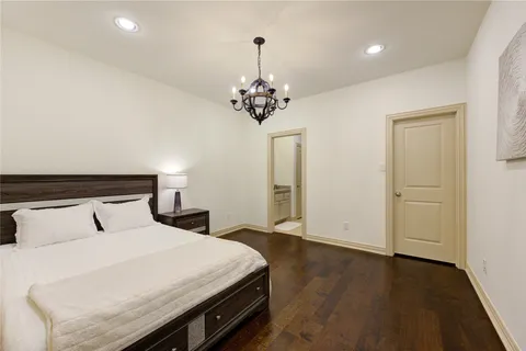 a spacious bedroom with a bed and a window