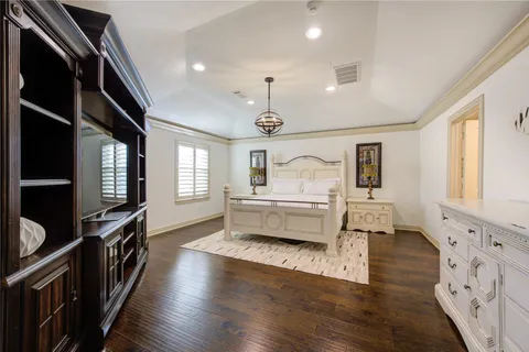 a view of kitchen with granite countertop stainless steel appliances a stove and wooden floor
