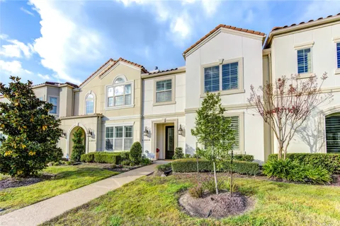 a view of a house with wooden fence