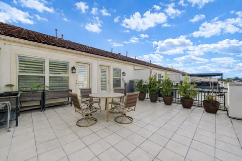 a view of a chairs and table in a patio