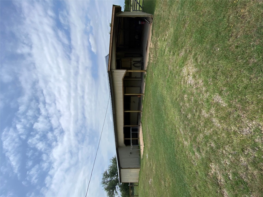 140 Oak Ridge Road Georgetown, TX 78628 - Photo 12 of 40 a view of a house with a backyard