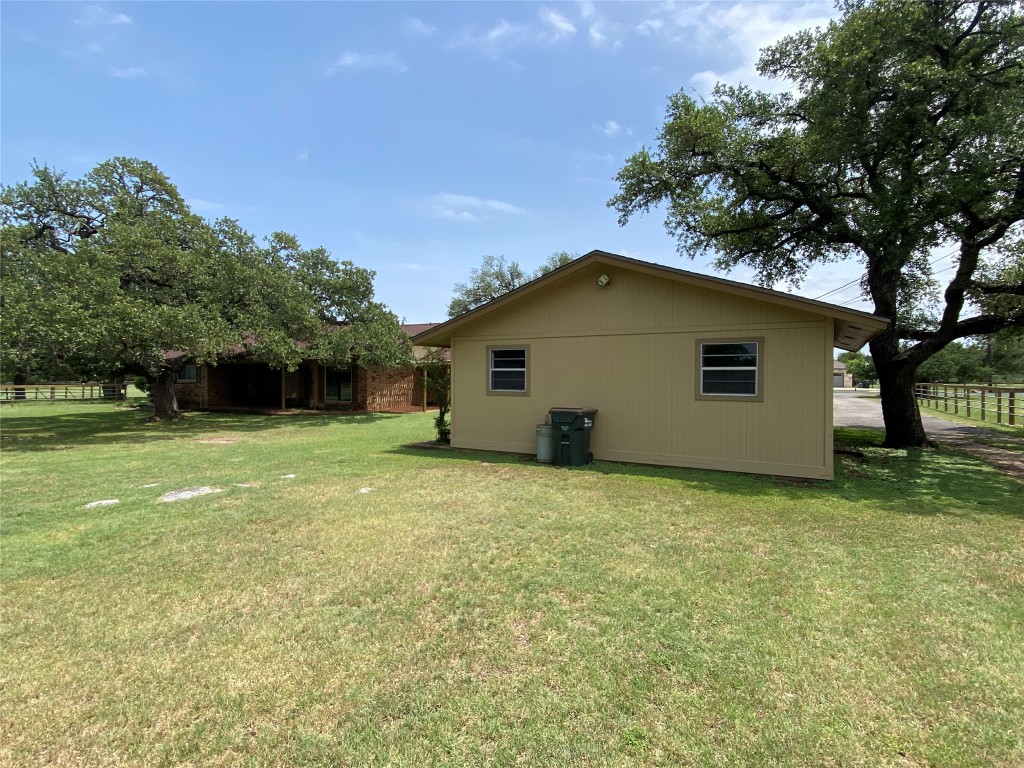 140 Oak Ridge Road Georgetown, TX 78628 - Photo 18 of 40 a view of a house with a yard