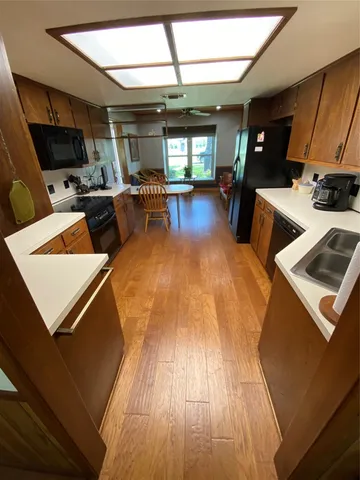 a bathroom with a sink toilet and window