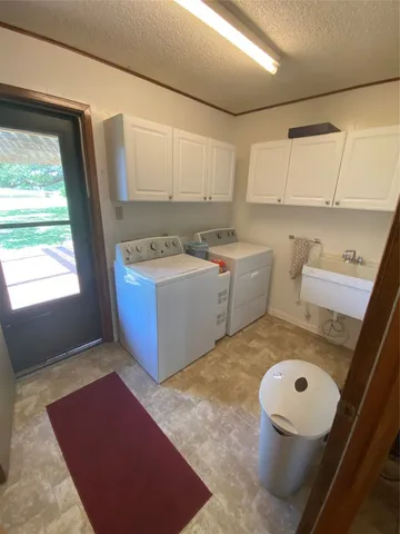 a bedroom with a bed window and couch