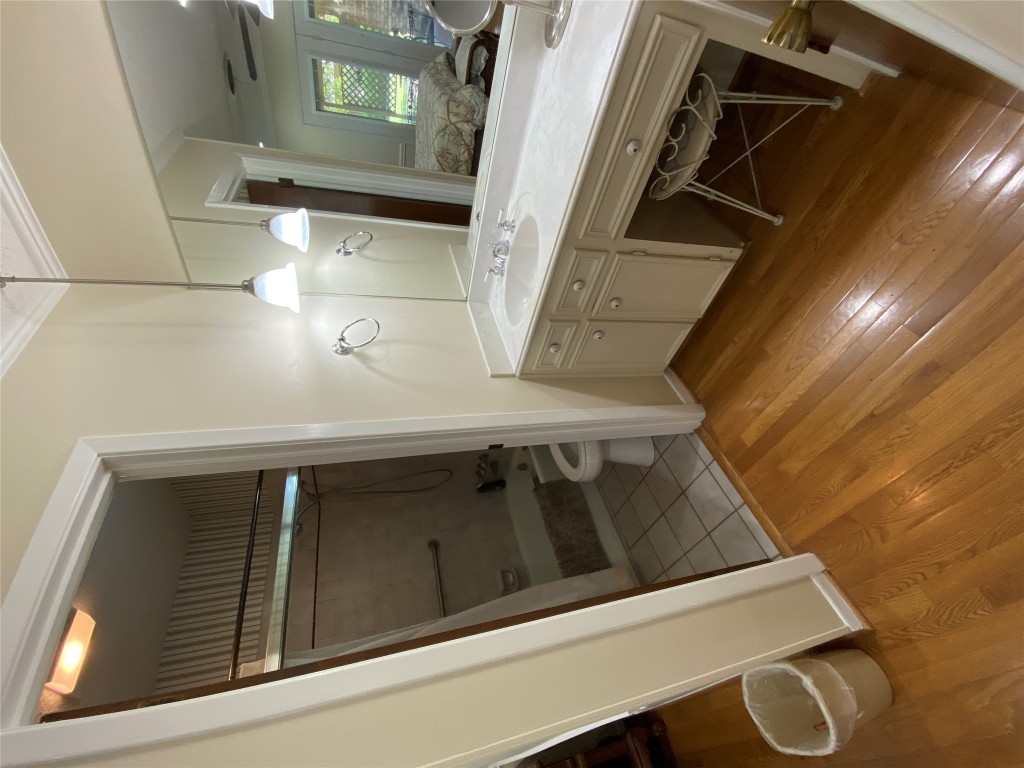 140 Oak Ridge Road Georgetown, TX 78628 - Photo 35 of 40 a bathroom with a sink a mirror and a shower