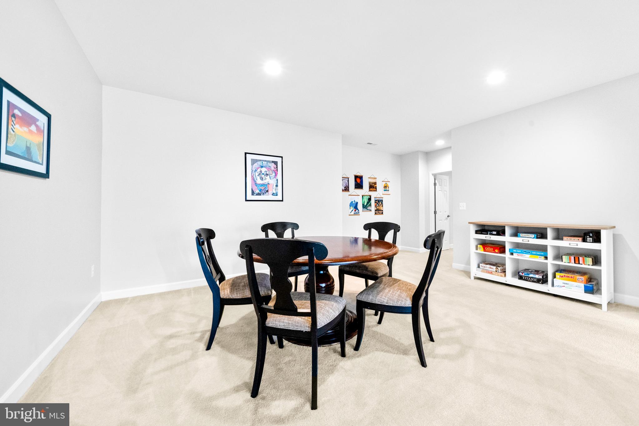 1639 Macon Street McLean, VA 22101 - Photo 61 of 86 a dining room with furniture and a book shelf