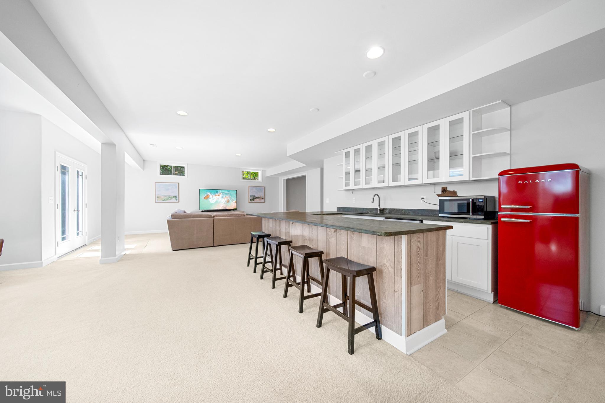 1639 Macon Street McLean, VA 22101 - Photo 66 of 86 a kitchen with stainless steel appliances granite countertop a refrigerator a stove a sink dishwasher with a dining table and chairs