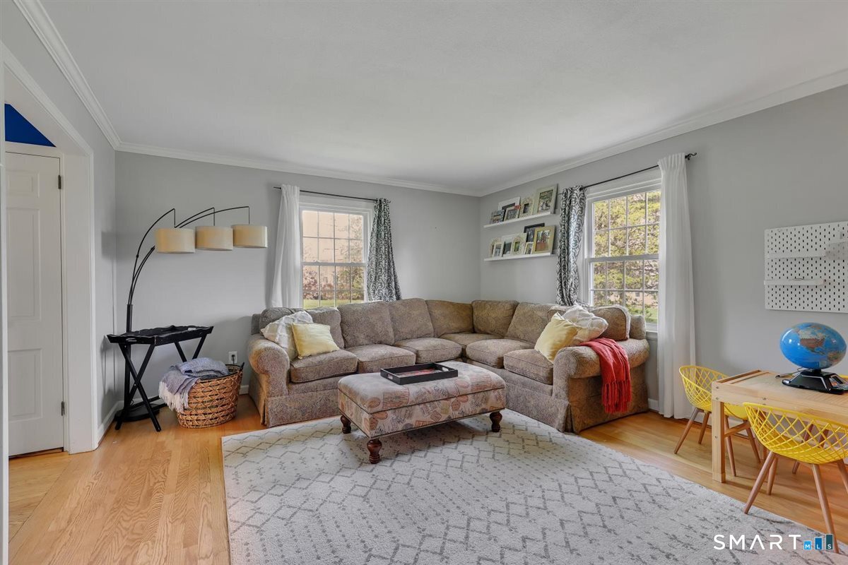 72 Old Post Road Wethersfield, CT 06109 - Photo 5 of 40 a living room with furniture and a window