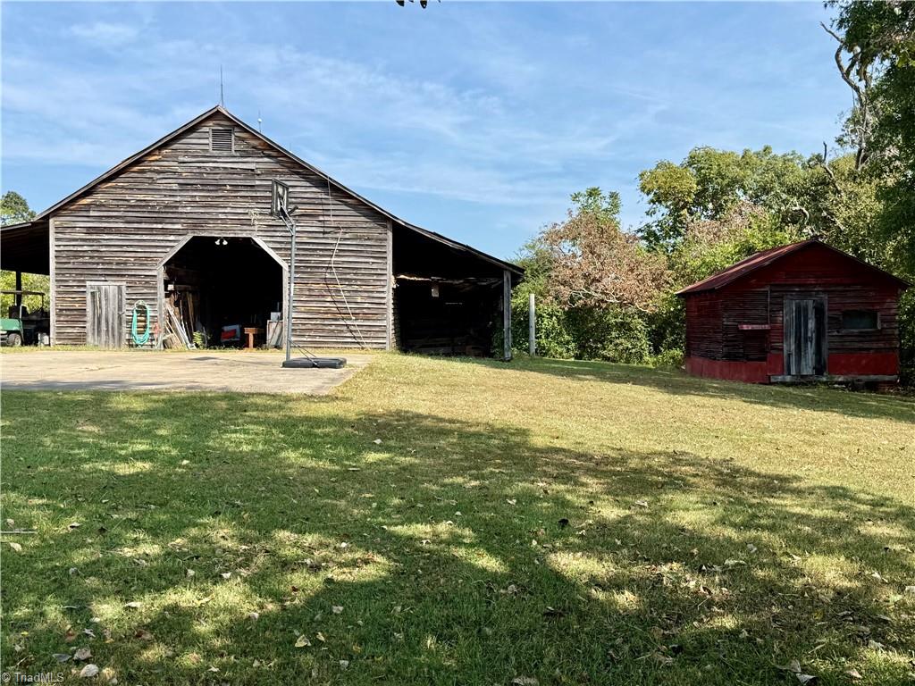 This view is from the side yard, facing the barn and corn crib. To the right is another building, referred to at the "Buzzard House".