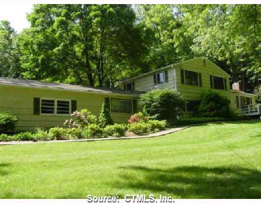 41 Mountain Road Wilton, CT 06897 - Photo 1 of 1 a front view of a house with a garden
