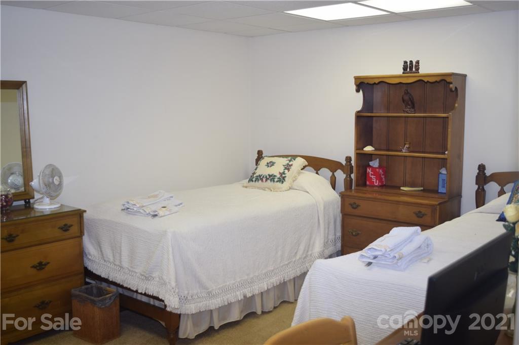 3189 Short Road Hickory, NC 28602 - Photo 13 of 24 a bedroom with a bed and cabinets
