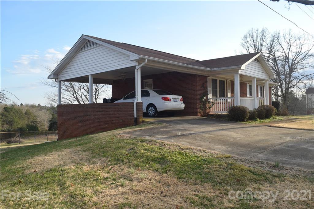 3189 Short Road Hickory, NC 28602 - Photo 6 of 24 a front view of a house with a yard and garage