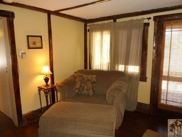 809 Talmadge Road Big Bear Lake, CA 92315 - Photo 11 of 25 a blue bed sitting in a bedroom next to a window