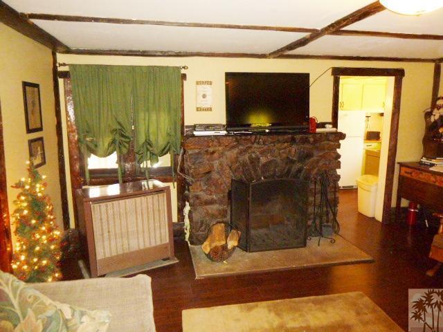 809 Talmadge Road Big Bear Lake, CA 92315 - Photo 13 of 25 a living room with fireplace furniture and a flat screen tv
