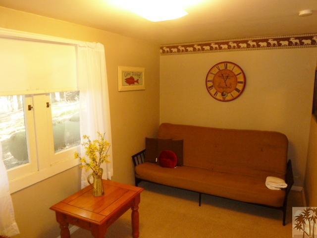 809 Talmadge Road Big Bear Lake, CA 92315 - Photo 15 of 25 a living room with a couch and a table