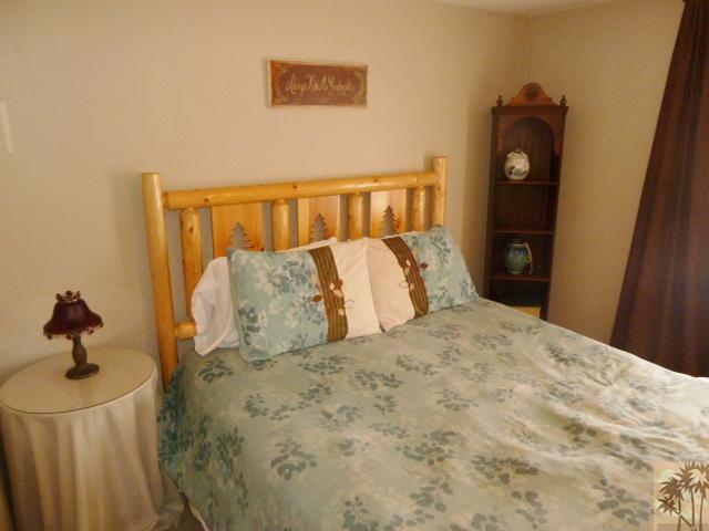 809 Talmadge Road Big Bear Lake, CA 92315 - Photo 17 of 25 a bedroom with a bed and wall painting