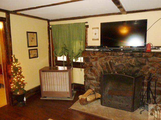 809 Talmadge Road Big Bear Lake, CA 92315 - Photo 19 of 25 a living room with a flat screen tv and a fireplace