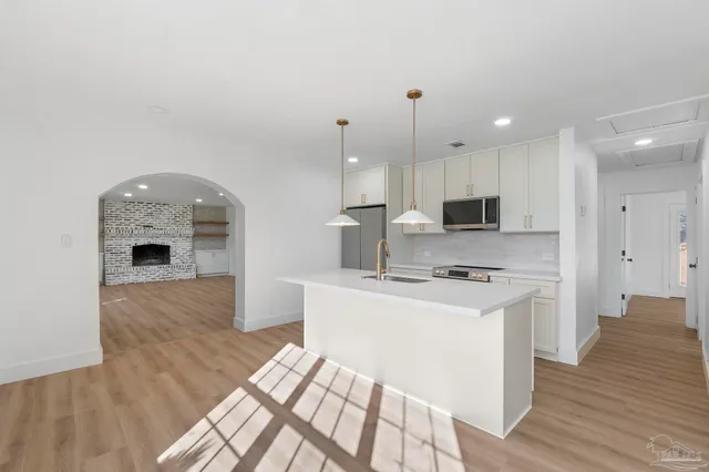 a large kitchen with cabinets