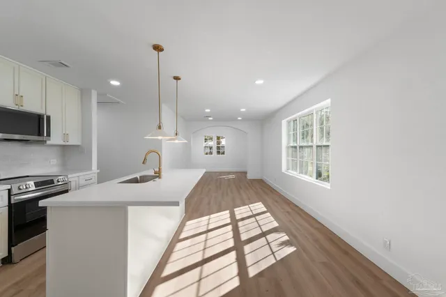 a kitchen with sink and window