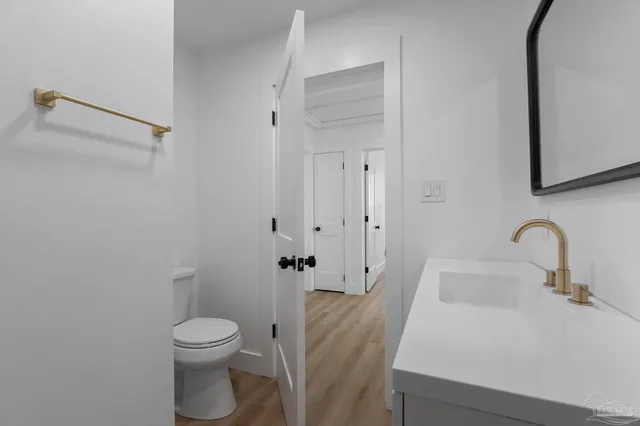 an empty room with a window and a ceiling fan