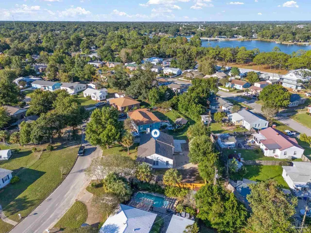 an aerial view of residential houses with outdoor space