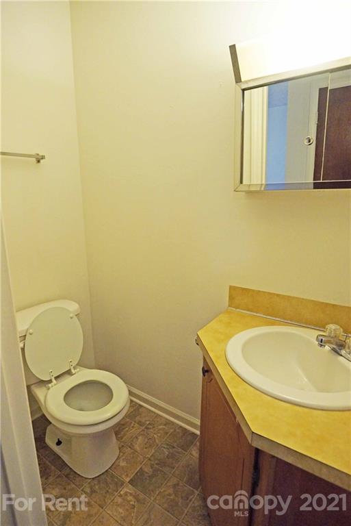 4887 County Home Road, Unit G2 Conover, NC 28613 - Photo 4 of 8 a bathroom with a toilet and a sink