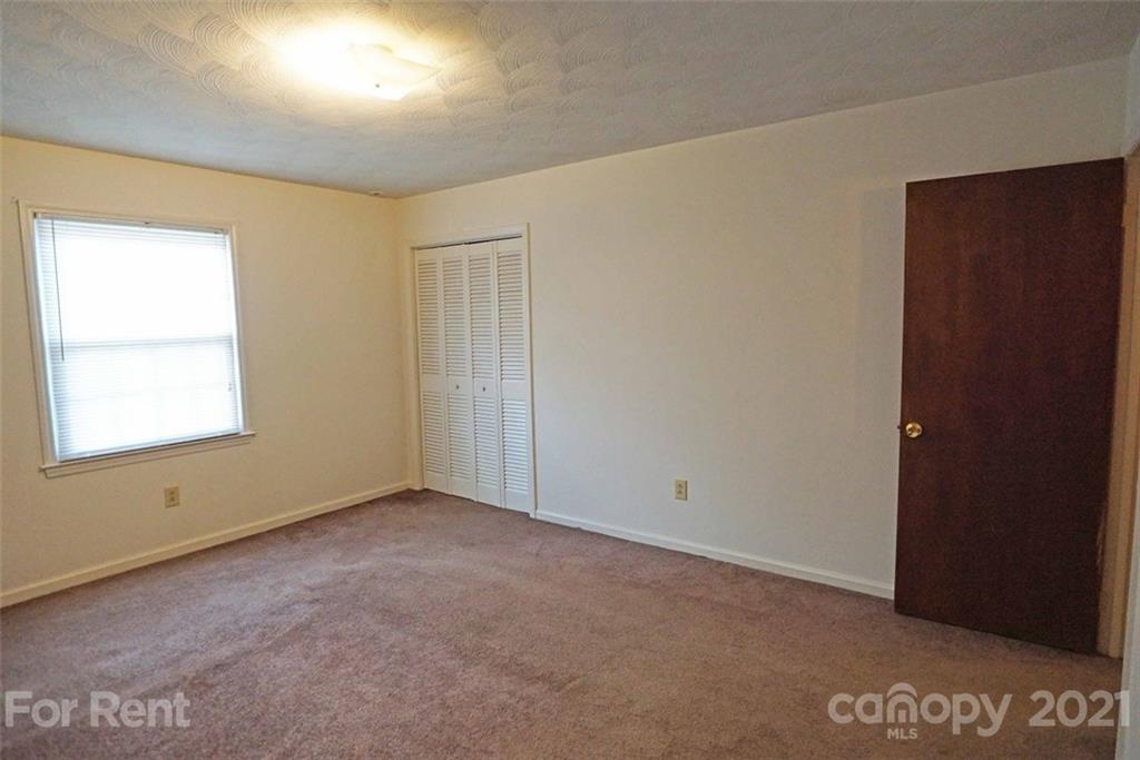 4887 County Home Road, Unit G2 Conover, NC 28613 - Photo 6 of 8 an empty room with a window
