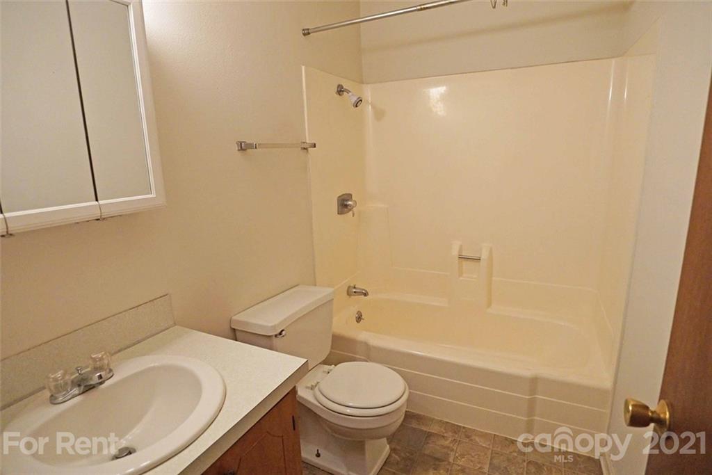 4887 County Home Road, Unit G2 Conover, NC 28613 - Photo 7 of 8 a bathroom with a sink toilet and shower