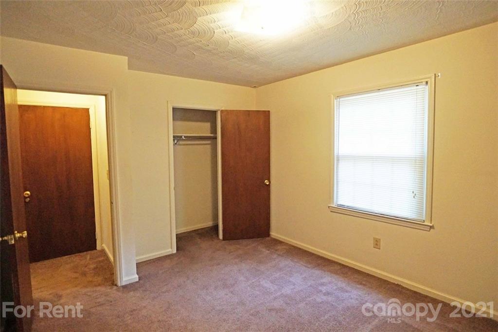 4887 County Home Road, Unit G2 Conover, NC 28613 - Photo 8 of 8 an empty room with windows