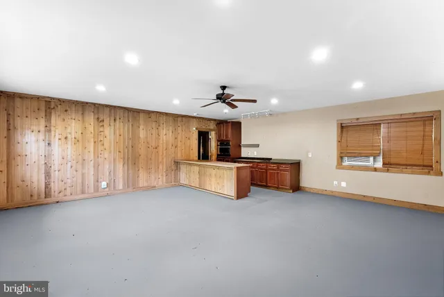 a view of a kitchen with a sink and a refrigerator