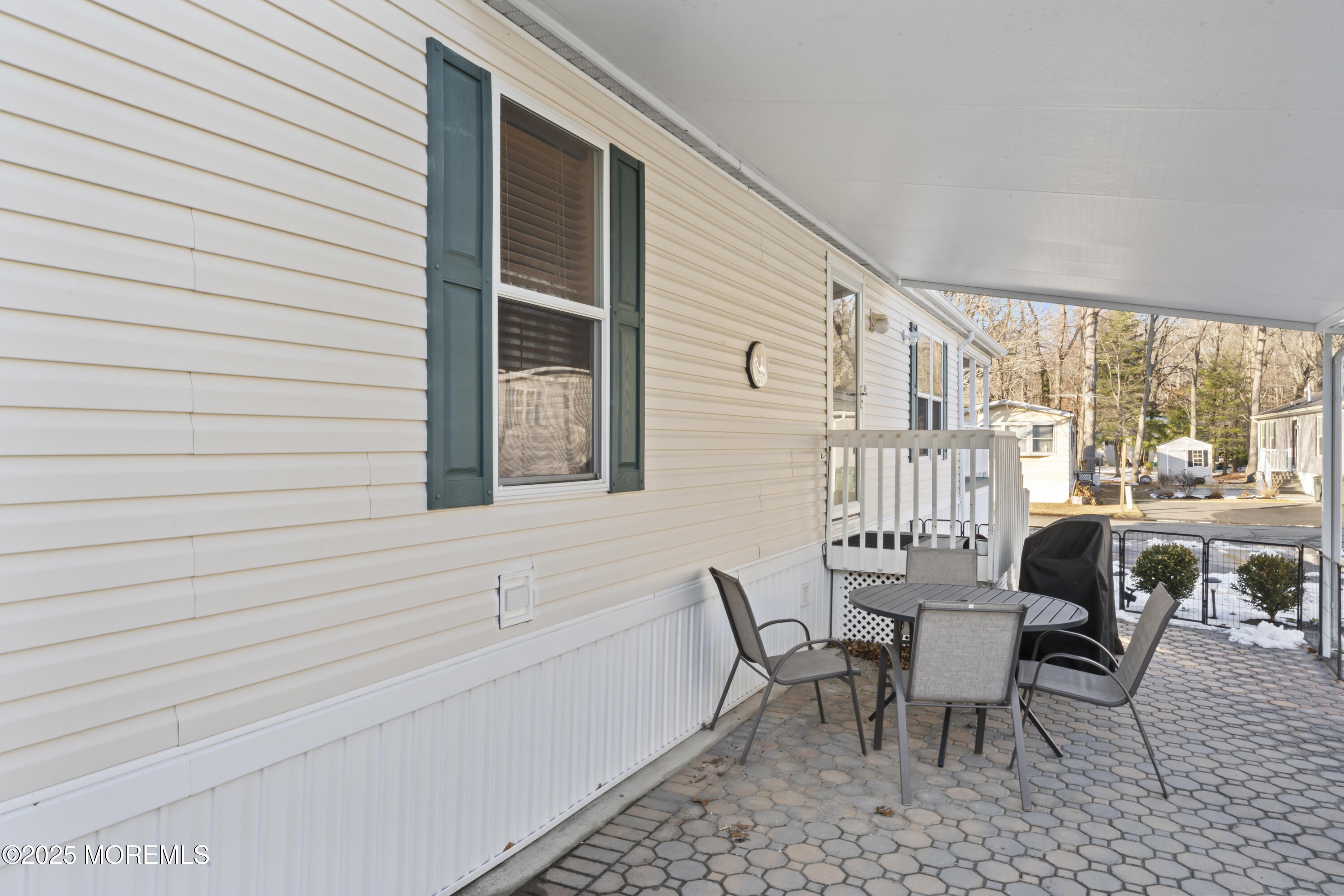 71 Village Road Morganville, NJ 07751 - Photo 16 of 20 Side Patio with Awning