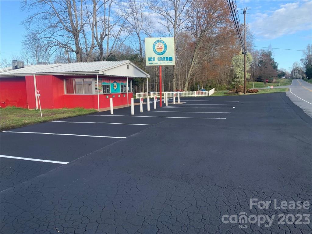 a view of street with stores