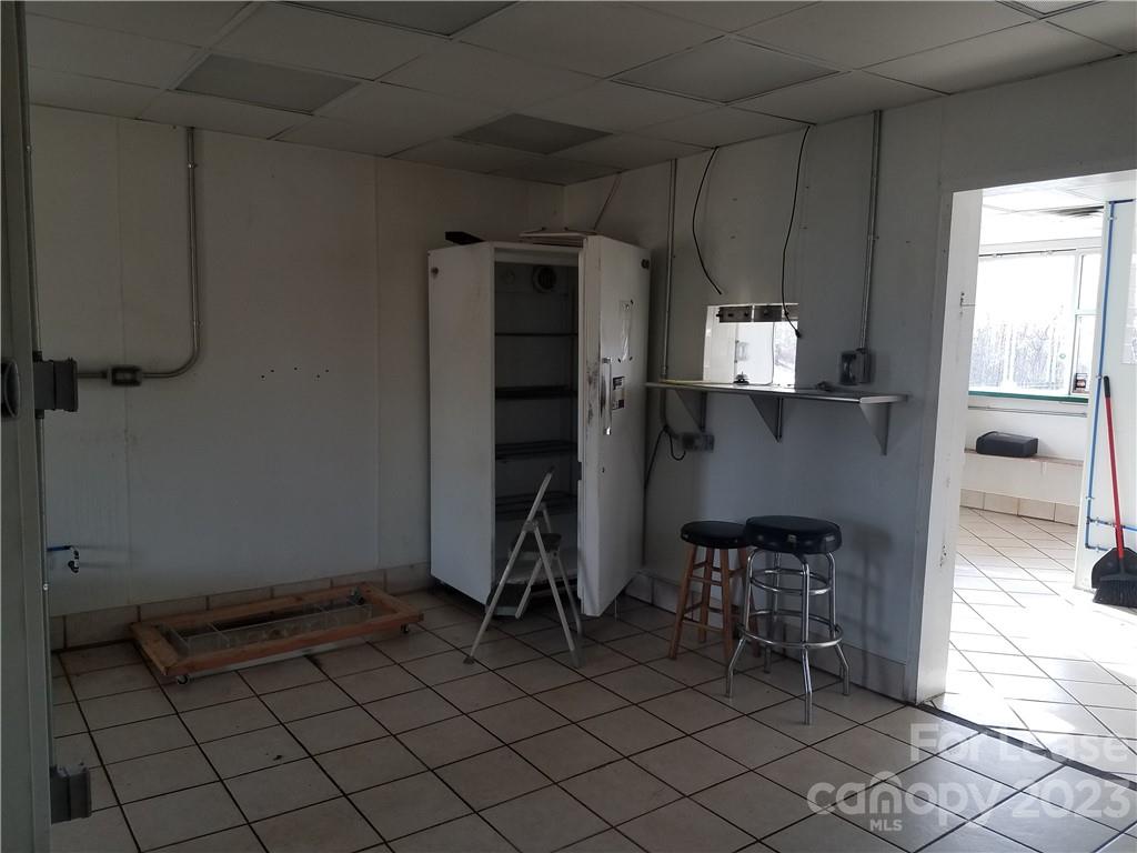286 Chimney Rock Road Rutherfordton, NC 28139 - Photo 13 of 31 a kitchen with a sink and a refrigerator