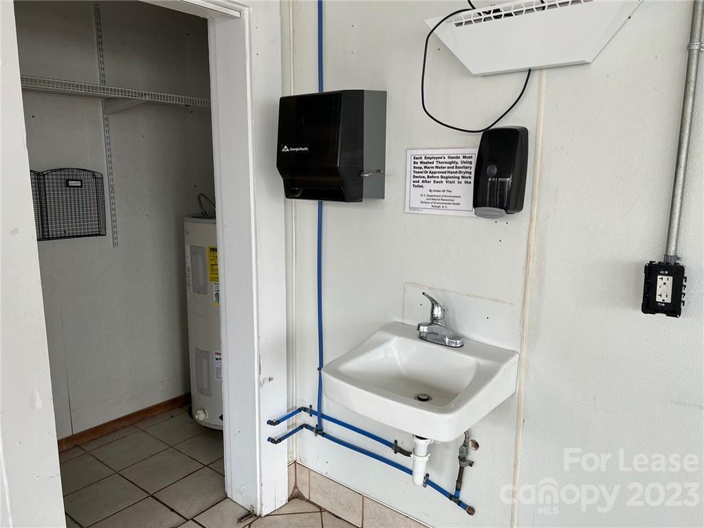 286 Chimney Rock Road Rutherfordton, NC 28139 - Photo 22 of 31 a bathroom with a sink and a mirror