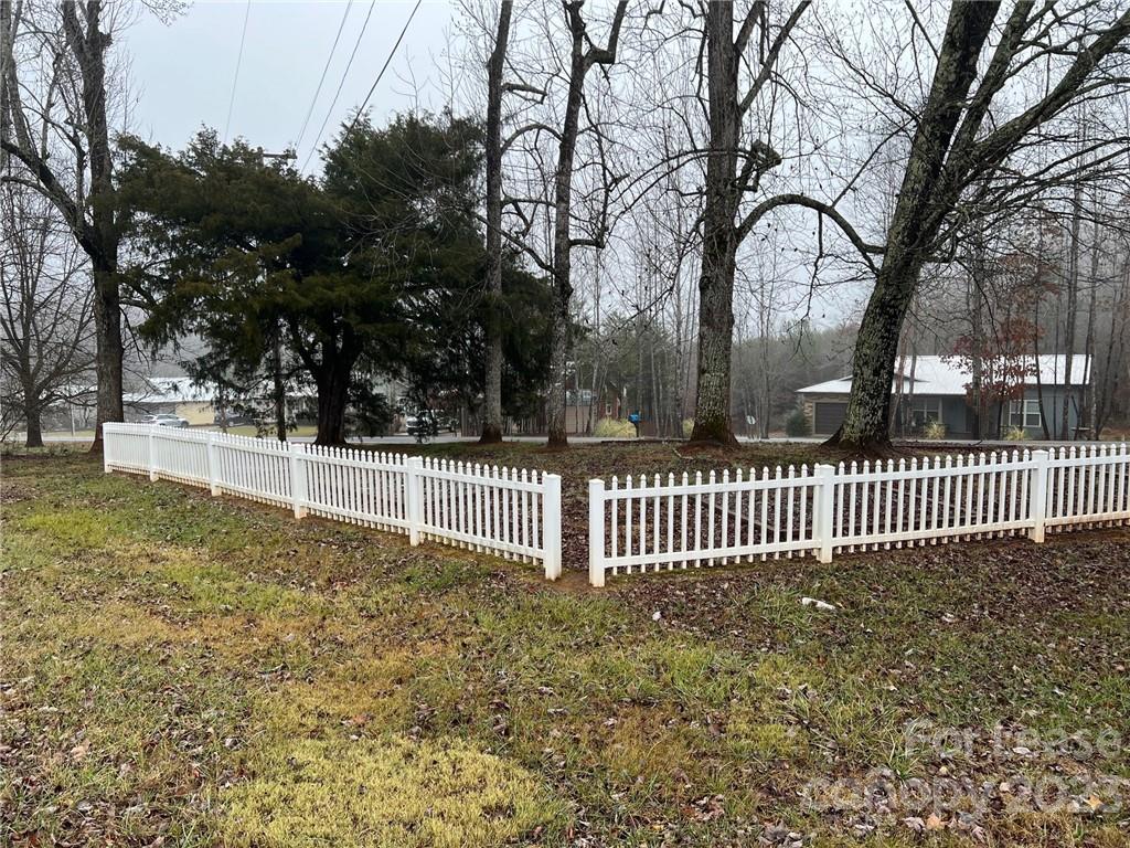 286 Chimney Rock Road Rutherfordton, NC 28139 - Photo 30 of 31 a view of a yard with wooden fence