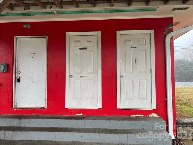 a kitchen with a sink and a refrigerator