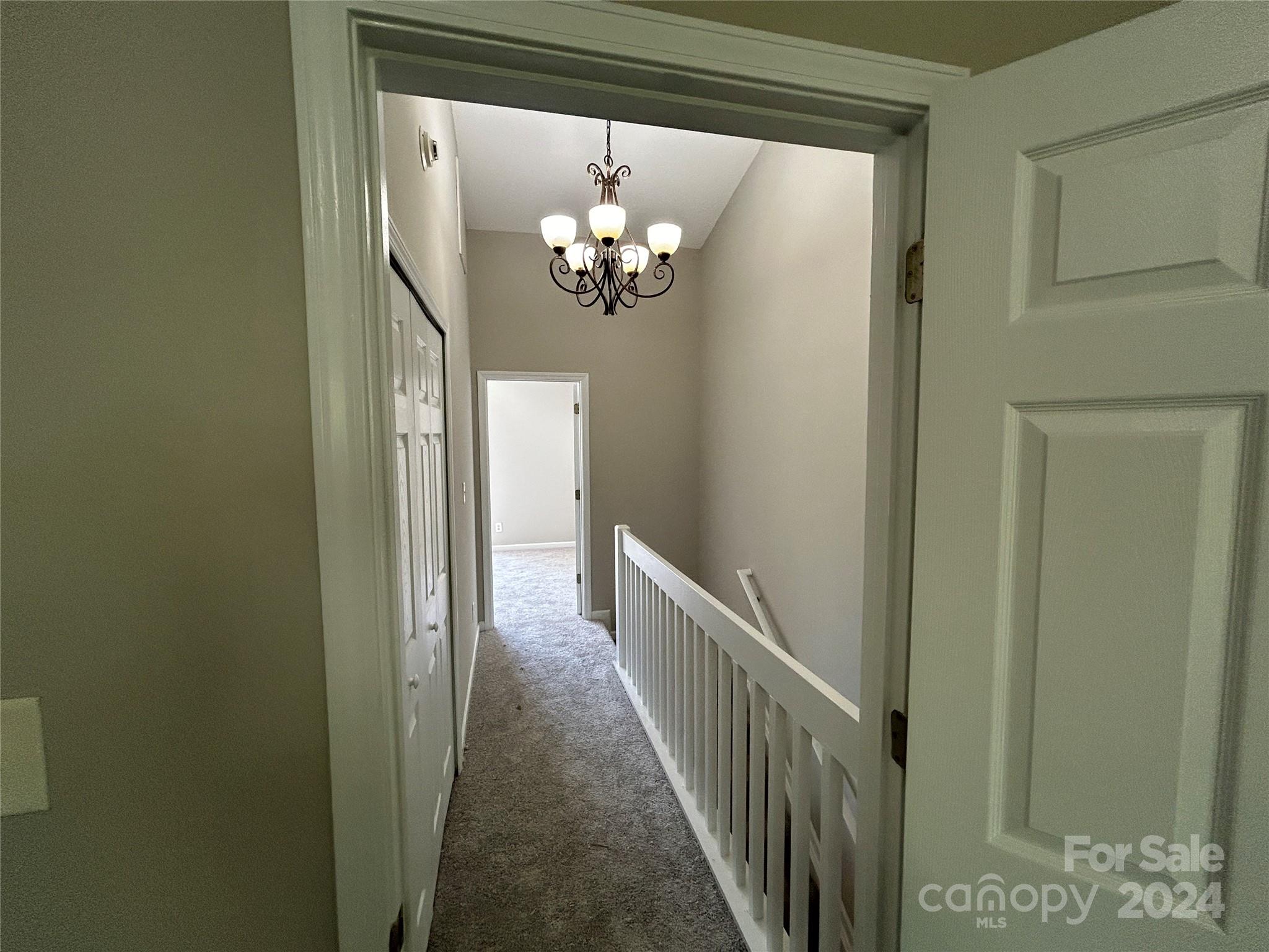 10511 Prairie Ridge Lane Charlotte, NC 28213 - Photo 15 of 17 a view of a hallway with wooden floor