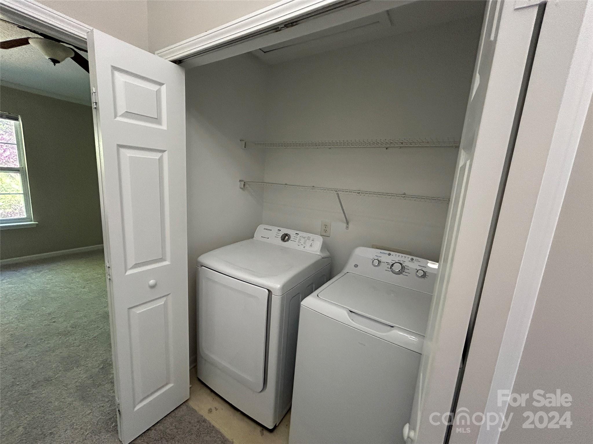 10511 Prairie Ridge Lane Charlotte, NC 28213 - Photo 16 of 17 a utility room with dryer and washer