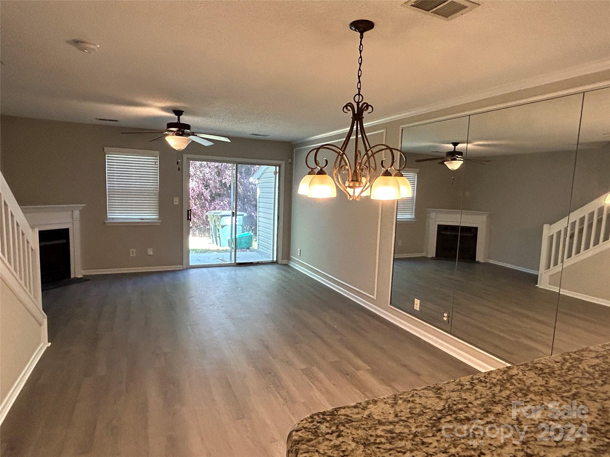 10511 Prairie Ridge Lane Charlotte, NC 28213 - Photo 5 of 17 a view of a room with wooden floor and windows