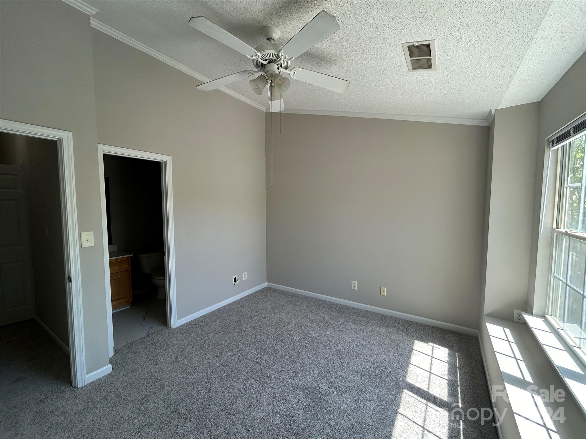 10511 Prairie Ridge Lane Charlotte, NC 28213 - Photo 10 of 17 a view of an empty room with a window