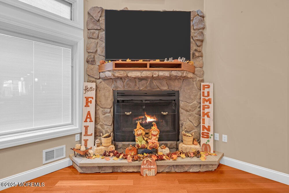 254 Alexander Avenue Howell, NJ 07731 - Photo 13 of 24 a living room with fireplace furniture and a fireplace