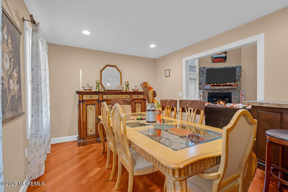 254 Alexander Avenue Howell, NJ 07731 - Photo 22 of 24 a view of a dining room with furniture and a chandelier