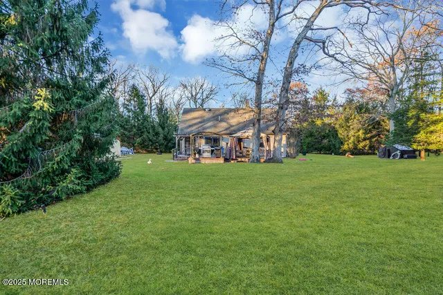 a view of a house with a big yard