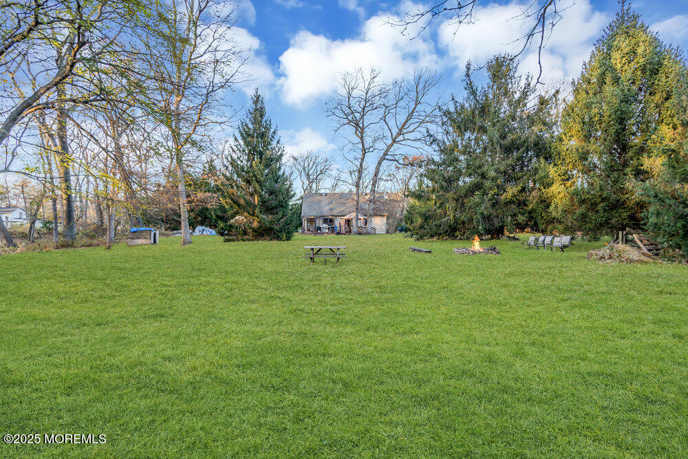 254 Alexander Avenue Howell, NJ 07731 - Photo 5 of 24 a green field with lots of trees