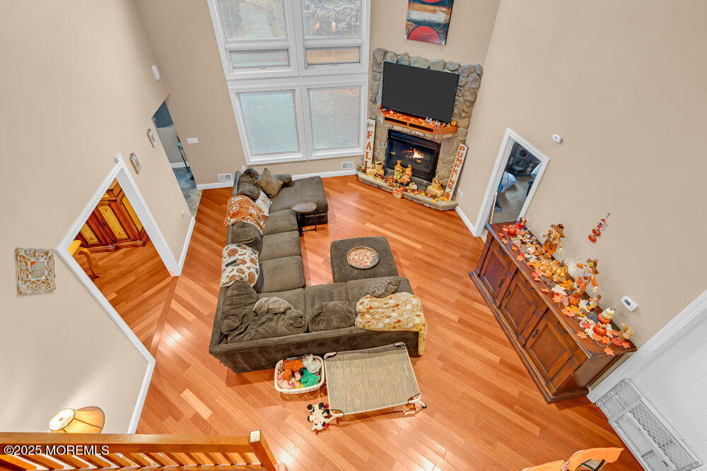 254 Alexander Avenue Howell, NJ 07731 - Photo 8 of 24 a living room with furniture and a flat screen tv