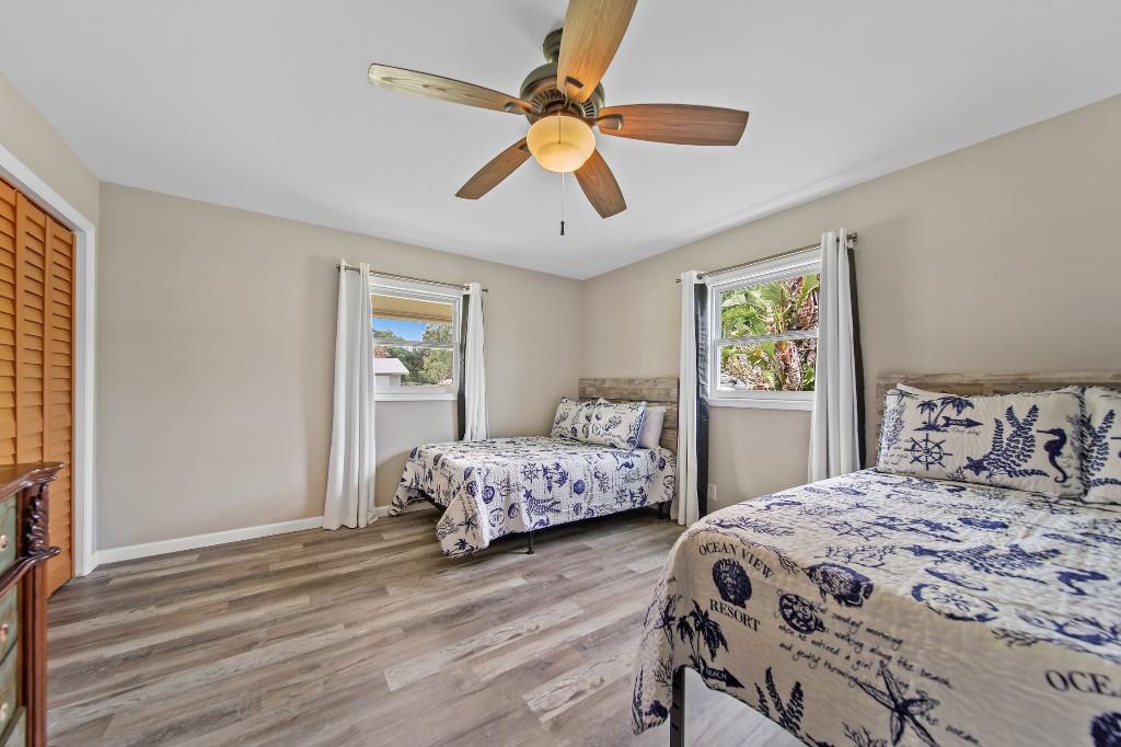 6275 Southeast Thomas Drive Stuart, FL 34997 - Photo 17 of 27 a bedroom with a bed and a window
