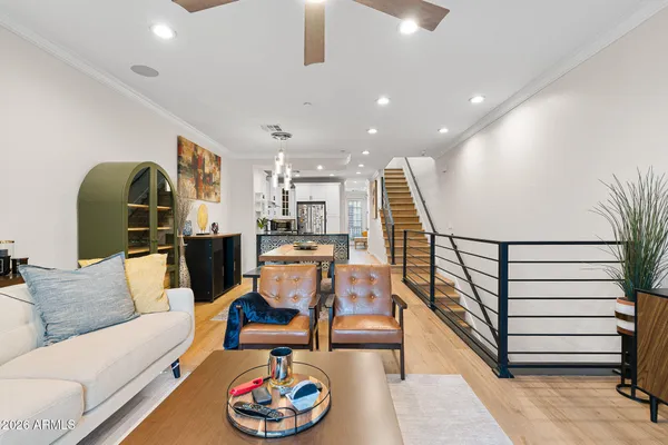 a dining room with furniture and a wooden floor