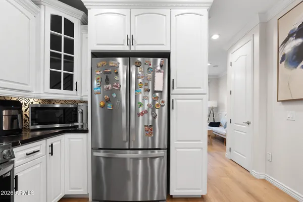 a view of a livingroom with furniture and hardwood floor