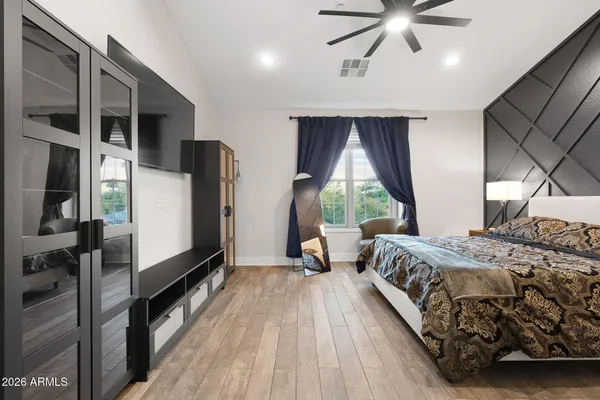 a bedroom with a bed and a lamp