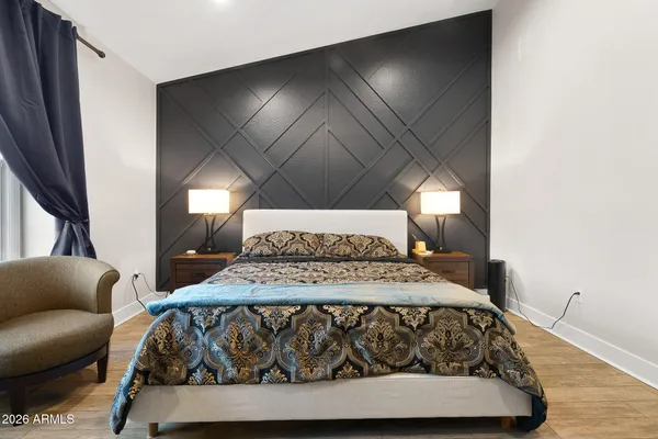 a bathroom with a mirror a sink and glass door